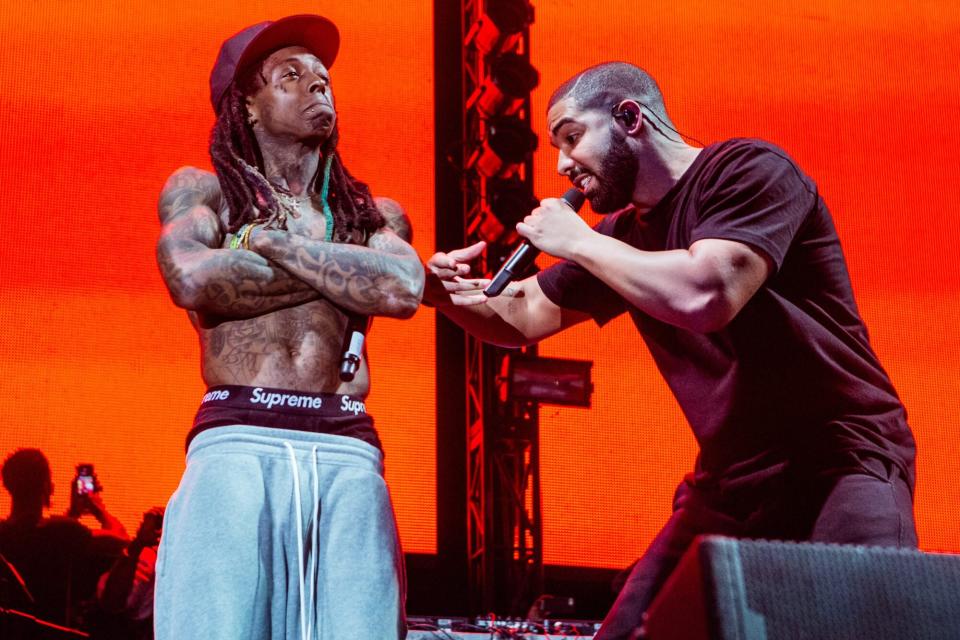 NEW ORLEANS, LA - AUGUST 28: Lil Wayne (L) and Drake perform at Lil Weezyana Festival at Champions Square on August 28, 2015 in New Orleans, Louisiana. (Photo by Josh Brasted/WireImage)