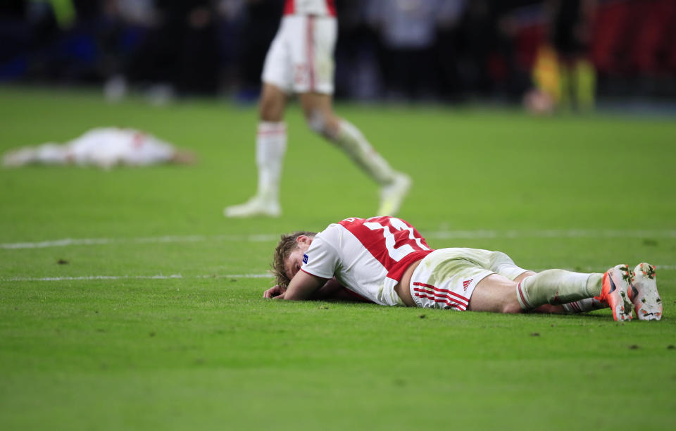 Ajax's Frenkie de Jong lies on the pitch at the end of the Champions League semifinal second leg soccer match between Ajax and Tottenham Hotspur at the Johan Cruyff ArenA in Amsterdam, Netherlands, Wednesday, May 8, 2019. (AP Photo/Peter Dejong)