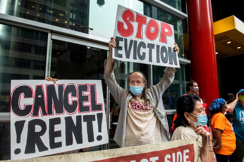 FILE - In this Aug. 4, 2021, file photo, housing advocates protest outside Gov. Andrew Cuomo's office on the eviction moratorium in New York. The Supreme Court is blocking part of New York's moratorium on evictions, put into effect because of the coronavirus pandemic, less than a month before it is supposed to expire anyway. (AP Photo/Brittainy Newman, File) ORG XMIT: WX122