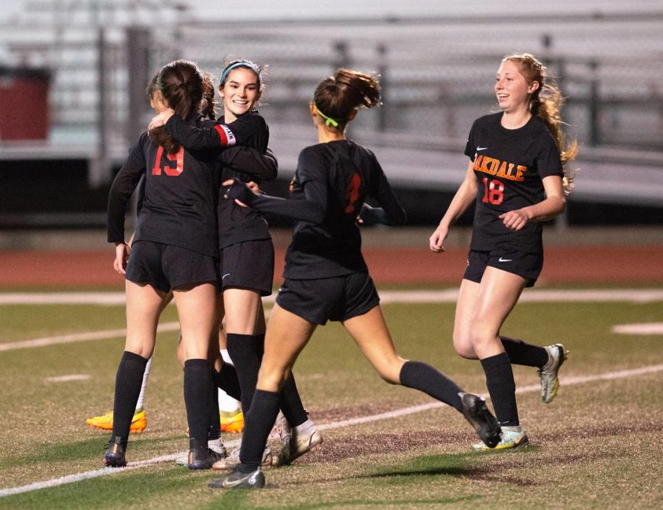 Oakdale’s Kyndra Obermeyer and her teammates celebrate after her goal during the Valley Oak League game with Kimball in Oakdale, Calif., Friday, Jan. 20, 2023. Oakdale won the game 2-1.