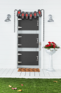 <p>Front doors? More like “morgue drawers.” This creepy idea will have all the kids running for the hills—and then running back for some candy.</p><p><strong>Craft the Doors: </strong>Attach three precut 20- by 30-inch pieces of foam core together with spray adhesive. Attach a piece of black paper, cut to size, to the top piece of foam core using spray adhesive. Insert the rectangular piece of two 6-inch stainless steel T-hinges between the first and second pieces of foam core on one of the short sides; “screw” in place. Place a 6 1/2-inch handle on the opposite side; “screw” in place. Cover exposed edges of the foam core with silver duct tape, folding any excess to the back. Make two more doors. Adhere to house door with heavy-duty self-adhesive Velcro. Cut five coffin shapes from black and gray kraft paper. Paint letters on gray coffins with <a href="https://www.amazon.com/Apple-Barrel-Acrylic-Assorted-J20401/dp/B0018N6IPY?tag=syn-yahoo-20&ascsubtag=%5Bartid%7C10050.g.1370%5Bsrc%7Cyahoo-us" rel="nofollow noopener" target="_blank" data-ylk="slk:red acrylic paint;elm:context_link;itc:0;sec:content-canvas" class="link ">red acrylic paint</a> to spell “morgue” and attach to black coffins with double-sided tape. Hang a plastic chain above the door and attach coffin cutouts with hot-glue. </p>