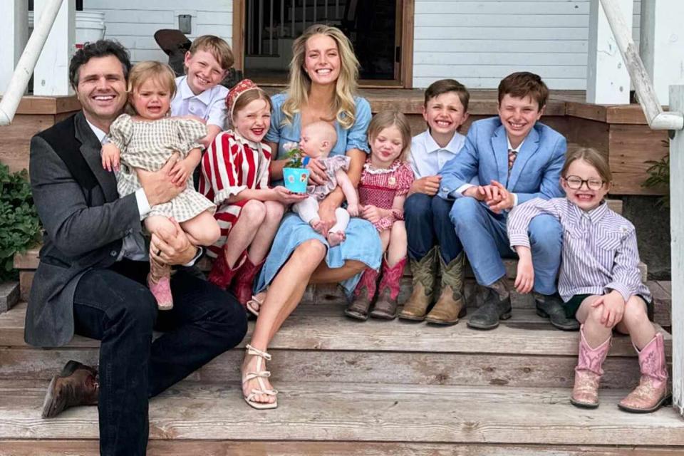 <p>Hannah Neeleman, Ballerina Farm/Instagram</p> Hannah Neeleman (center, in blue) poses with husband Daniel (left) and their kids