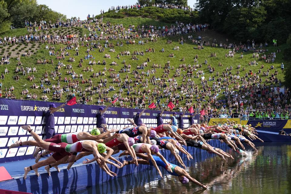 Athletes start in the men's Triathlon during the European Championships in Munich, Germany, Saturday, Aug. 13, 2022. (AP Photo/Martin Meissner)