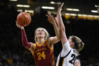 Iowa State guard Ashley Joens (24) shoots over Iowa guard Kate Martin (20) during the first half of an NCAA college basketball game, Wednesday, Dec. 7, 2022, in Iowa City, Iowa. (AP Photo/Charlie Neibergall)