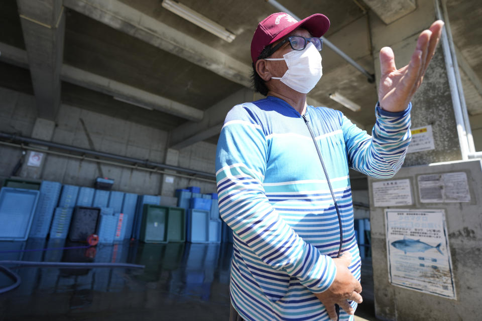 Hideaki Igari, fish market middleman, speaks with the Associated Press at Numanouchi port, Iwaki, northeastern Japan, near the Fukushima Daiichi nuclear power plant, damaged by a massive March 11, 2011, earthquake and tsunami, on Friday, Aug. 25, 2023. Igari said prices for flounder, among Fukushima's signature fish known as Joban-mono, was about 10% lower on Friday at a morning auction, first since the Fukushima Daiichi started releasing treated and diluted radioactive wastewater into the Pacific Ocean on Thursday. (AP Photo/Eugene Hoshiko)