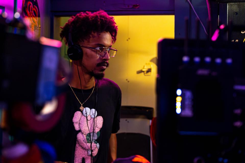 OKC writer-director Benjamin Tefera watches a take Friday on the set of "Defiant Vanity" during filming at Cookies on Western in Oklahoma City.