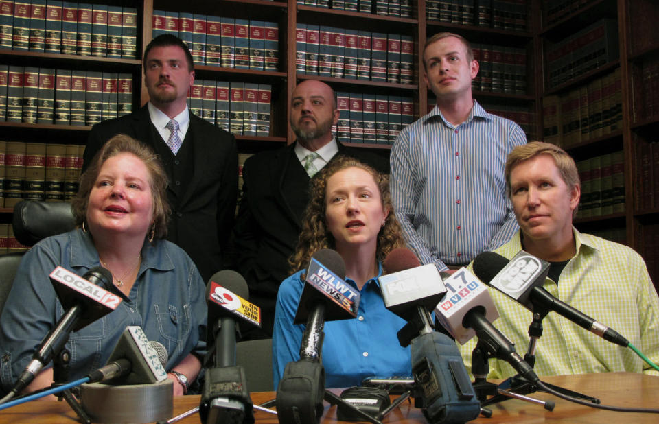 Some of the 12 plaintiffs named in a lawsuit seeking to strike down Ohio's gay marriage ban speak to media Wednesday, April 30, 2014 at a Cincinnati law firm. In the front row, from left, are Michelle Gibson, Mary Koehler, and Ronny Beck; in the back row, from left, are Karl Rece Jr., Gary Goodman, and Ethan Fletcher. All are involved in same-sex relationships and are seeking the right to marry in Ohio. (AP Photo/Amanda Lee Myers)