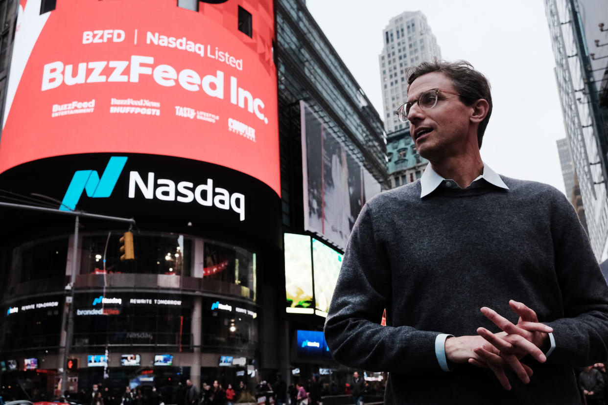 NEW YORK, NEW YORK - DECEMBER 06: BuzzFeed CEO Jonah Peretti stands in front of the Nasdaq market site in Times Square as the company goes public through a merger with a special-purpose acquisition company on December 06, 2021 in New York City. Shares of the digital media company, trading under the new ticker “BZFD,” rose 12.7% to $10.84 as markets opened Monday. (Photo by Spencer Platt/Getty Images)