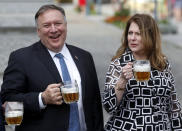 U.S. Secretary of State Mike Pompeo, left, and his wife Susan Pompeo hold a glass of beer during a visit at a brewery in Pilsen near Prague, Czech Republic, Tuesday, Aug. 11, 2020. U.S. Secretary of State Mike Pompeo is in Czech Republic at the start of a four-nation tour of Europe. Slovenia, Austria and Poland are the other stations of the trip. (AP Photo/Petr David Josek, Pool)