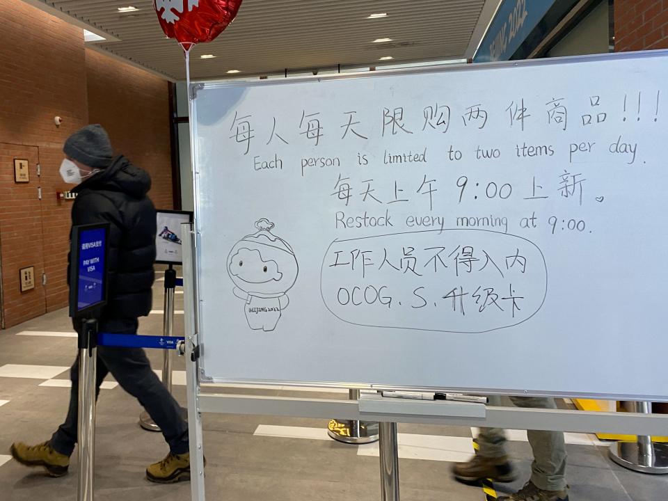 A note on a whiteboard outside the souvenir shop in a Winter Olympics media centre warns customers that they are limited to buying two items because they are in short supply, following a surge in demand for merchandise featuring the official mascot Bing Dwen Dwen, in Zhangjiakou, China, February 9, 2022.