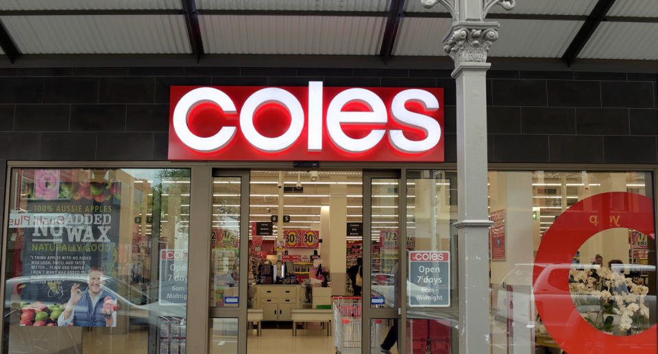 Coles store front with fluorescent sign.