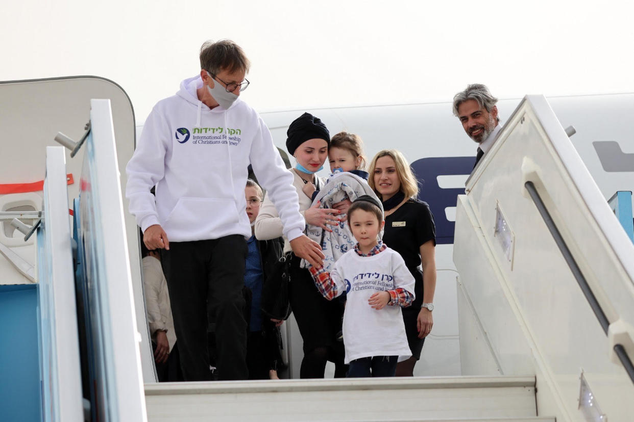 The children and their caregivers exiting the plane, safely in Israel.  (Courtesy The International Fellowship of Christians and Jews)