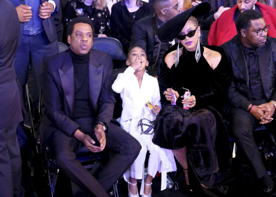Blue Ivy Carter snacks at the 2018 Grammys with dad Jay-Z and mom Beyoncé.<p>Timothy Kuratek/CBS via Getty Images</p>