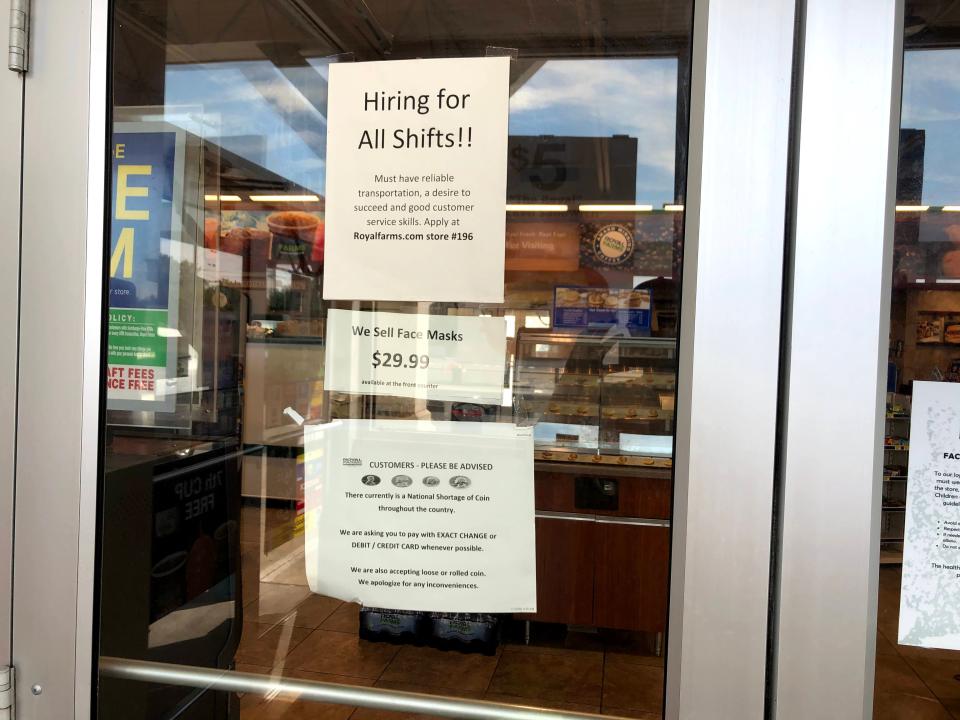 A sign at the Royal Farms on Kirkwood Highway advertises job openings for all shifts.