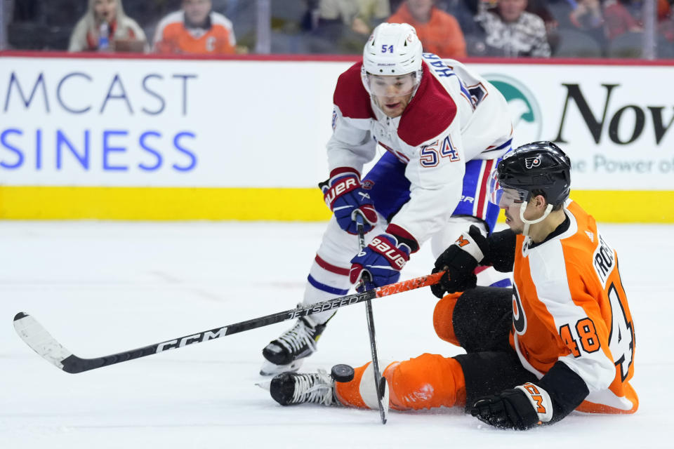 Philadelphia Flyers' Morgan Frost (48) collides with Montreal Canadiens' Jordan Harris (54) during the second period of an NHL hockey game, Tuesday, March 28, 2023, in Philadelphia. (AP Photo/Matt Slocum)