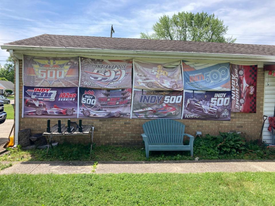 Faded Indy 500 flags decorate the wall of Alan Burke's home in Speedway at the corner of West 22nd Street and Fisher Avenue on May 20, 2024.