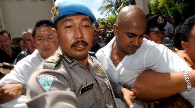 Andrew Chan (left) and Myuran Sukumaran (right) led away by Indonesian officials. Photo: AAP