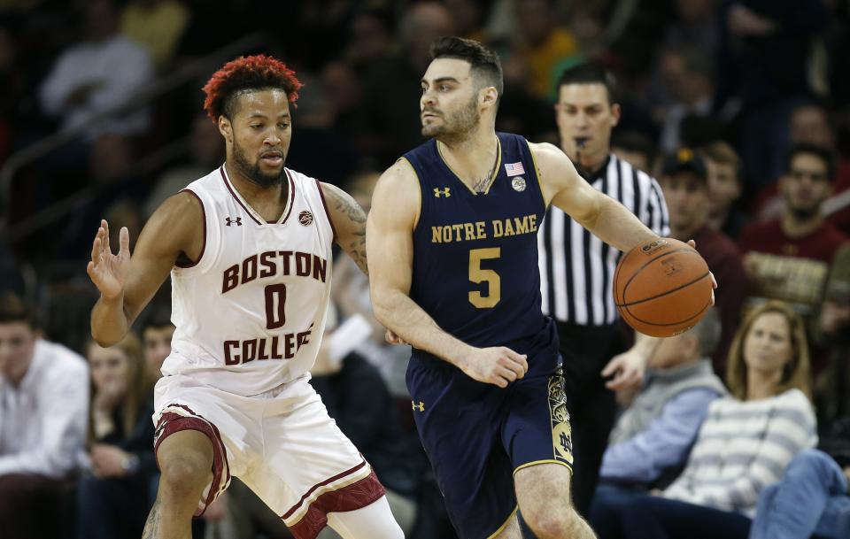 Boston College’s Ky Bowman (0) defends against Notre Dame’s Matt Farrell (5) during the first half of an NCAA college basketball game in Boston. (AP)