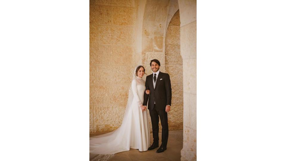 Princess Iman in a white wedding dress and Jameel Alexander Thermiotis in a black suit