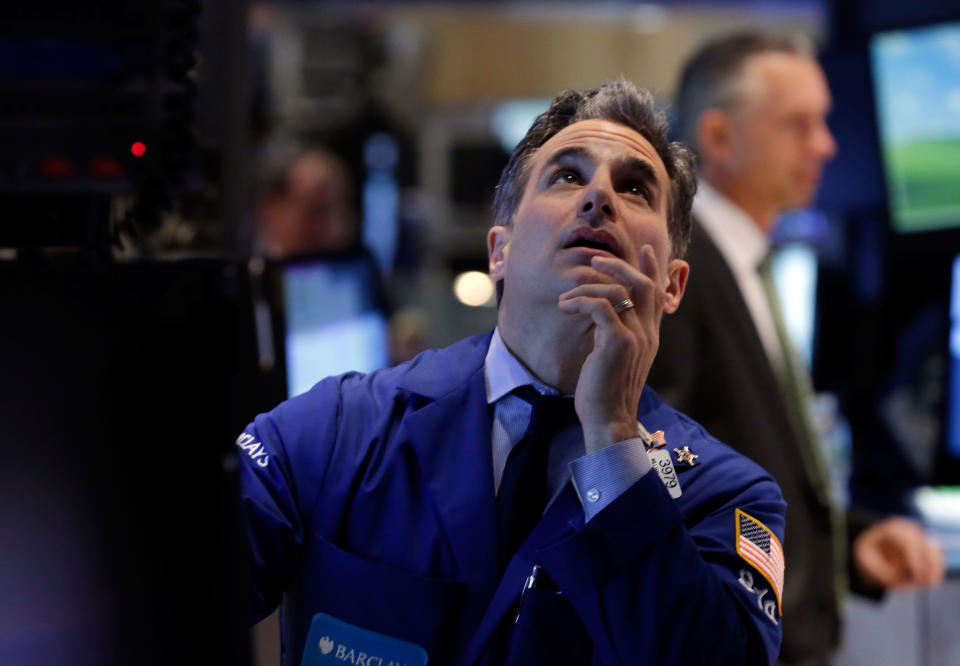 Specialist Anthony Rinaldi works at his post on the floor of the New York Stock Exchange, Friday, April 11, 2014. Weaker earnings at JPMorgan Chase are dragging bank stocks lower in early trading. Technology and biotech stocks also fell, a day after the worst rout for the Nasdaq composite index since 2011. (AP Photo/Richard Drew)