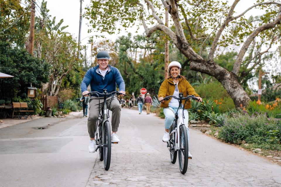 Two people seen riding Aventon e-bikes.