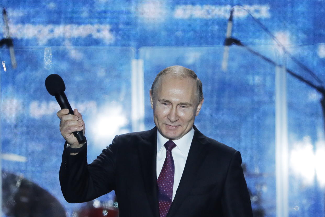 Vladimir Putin addresses supporters during a rally celebrating the fourth anniversary of Russia’s annexation of Crimea (Getty)