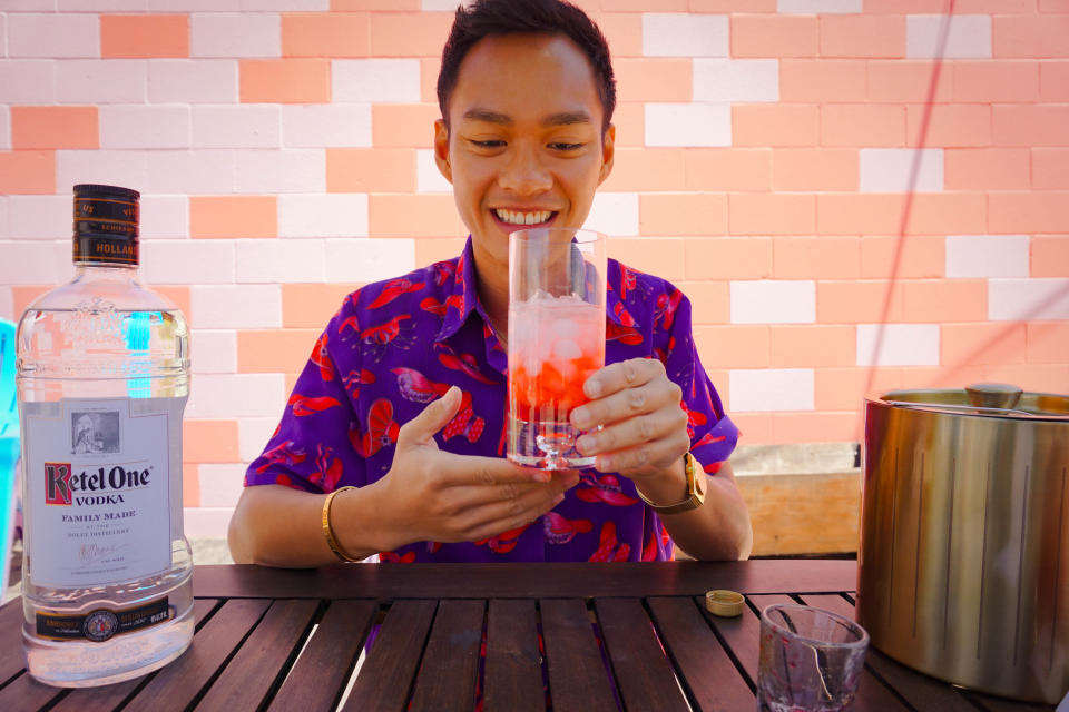 The liquid takes up about the same amount of the glass, but now the bottom half of it has turned red