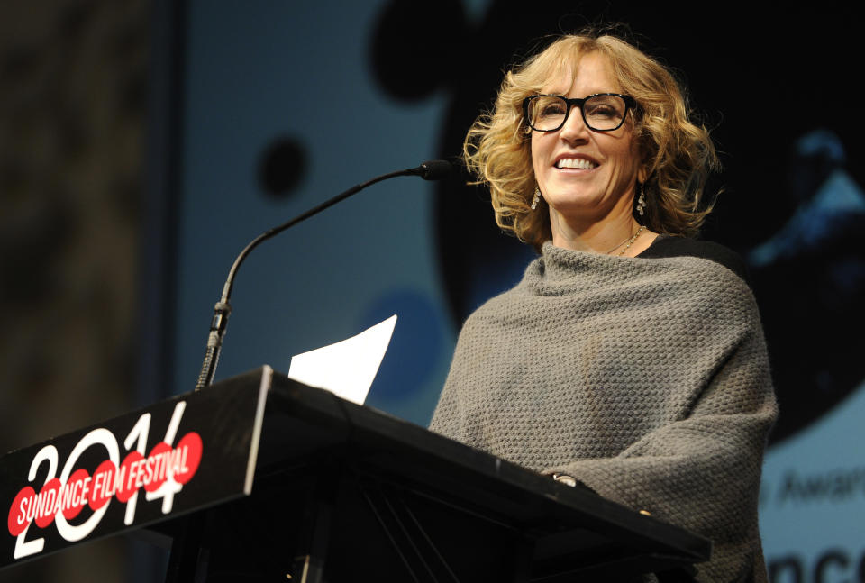 Actress Felicity Huffman speaks from the stage during the 2014 Sundance Film Festival Awards Ceremony on Saturday, Jan. 25, 2014, in Park City, Utah. (Photo by Chris Pizzello/Invision/AP)