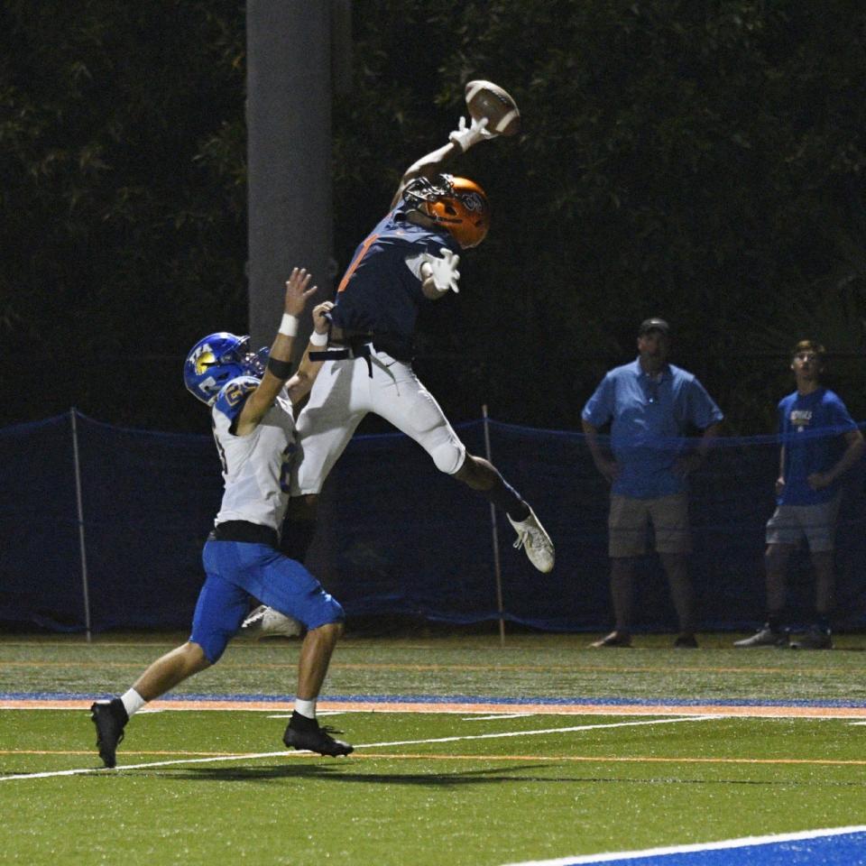 Benjamin's Micah Mays reaches up to make a play on a high-thrown ball during the second quarter of a 55-24 regional semifinals win over First Academy on Nov. 19, 2021.