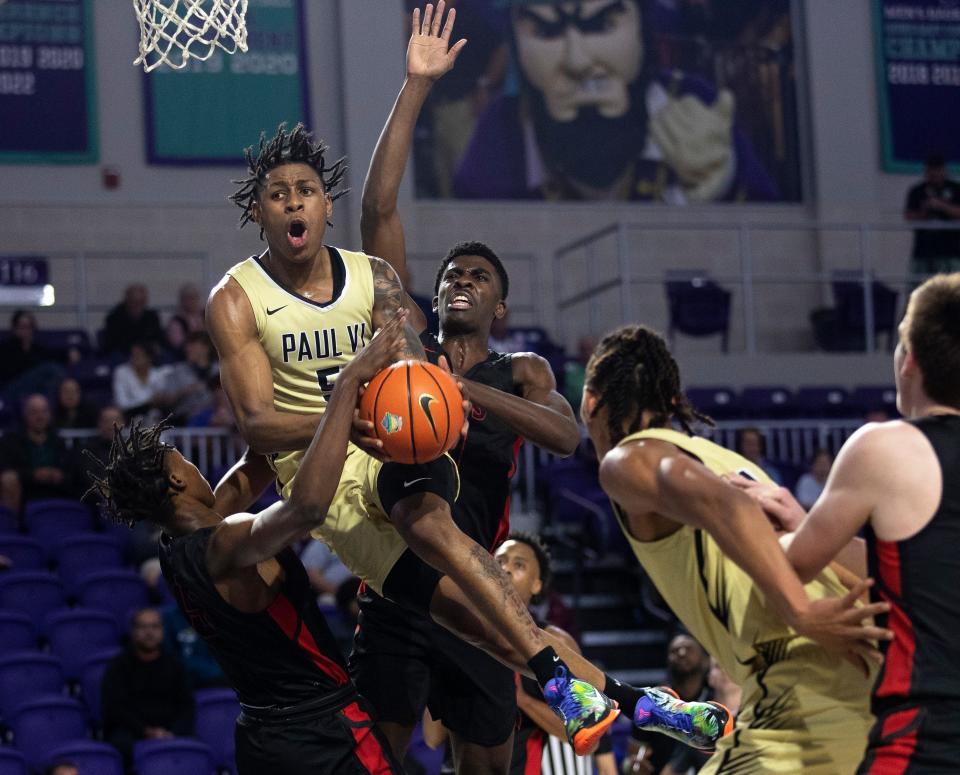 DeShawn Harris-Smith of Paul VI goes up for a shot against Lake Highlands in the City of Palms Classic on Monday, Dec. 19, 2022, at Suncoast Credit Union Arena in Fort Myers. 