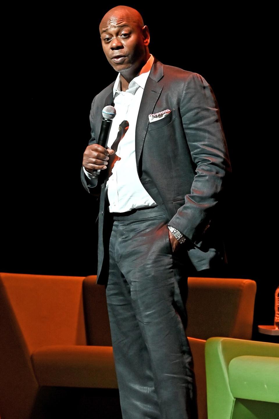 WASHINGTON, DC - JUNE 20: Dave Chappelle speaks onstage during the Dave Chappelle theatre dedication ceremony at Duke Ellington School of the Arts on June 20, 2022 in Washington, DC. (Photo by Shannon Finney/Getty Images)