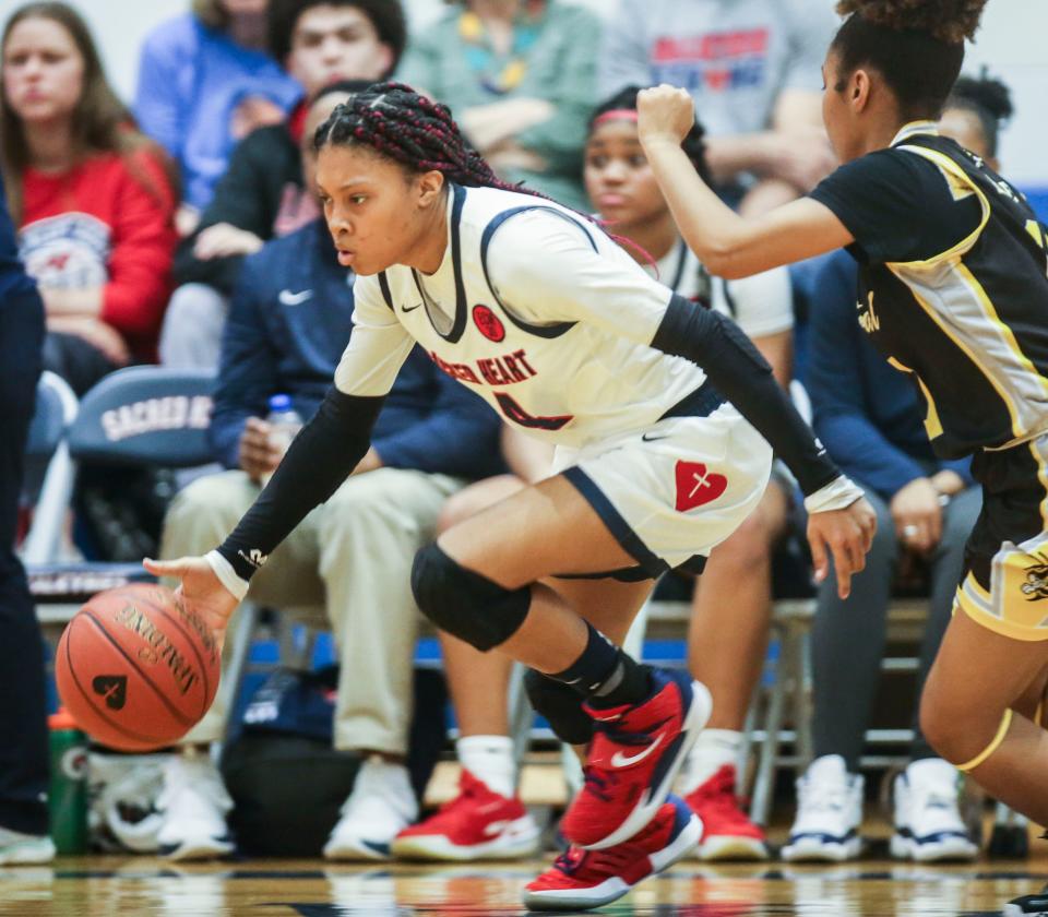 Triniti Ralston drives during a game against visiting Central High School in February 2022. Ralston was instrumental in the Valkyries' 2021 state championship.