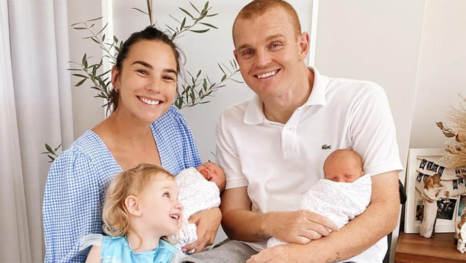 Teigan Power and Alex McKinnon, pictured here with their daughters.