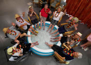 <p>Residents at the Ter Biest house for elderly persons refresh their feet in a pool on a hot summer day, in Grimbergen, Belgium, Aug. 3, 2018. (Photo: Yves Herman/Reuters) </p>