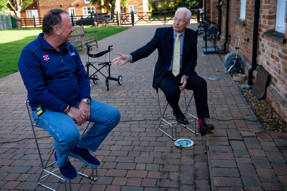 Former cricketer David Gower (right)alongside Lloyd Scott, at the launch event for Scott's Three Peaks Challenge at Captain Sir Tom Moore's home in Marston Moretaine, Bedfordshire. The veteran fundraiser will attempt to climb the Three Peaks whilst wearing a deep sea diving suit.