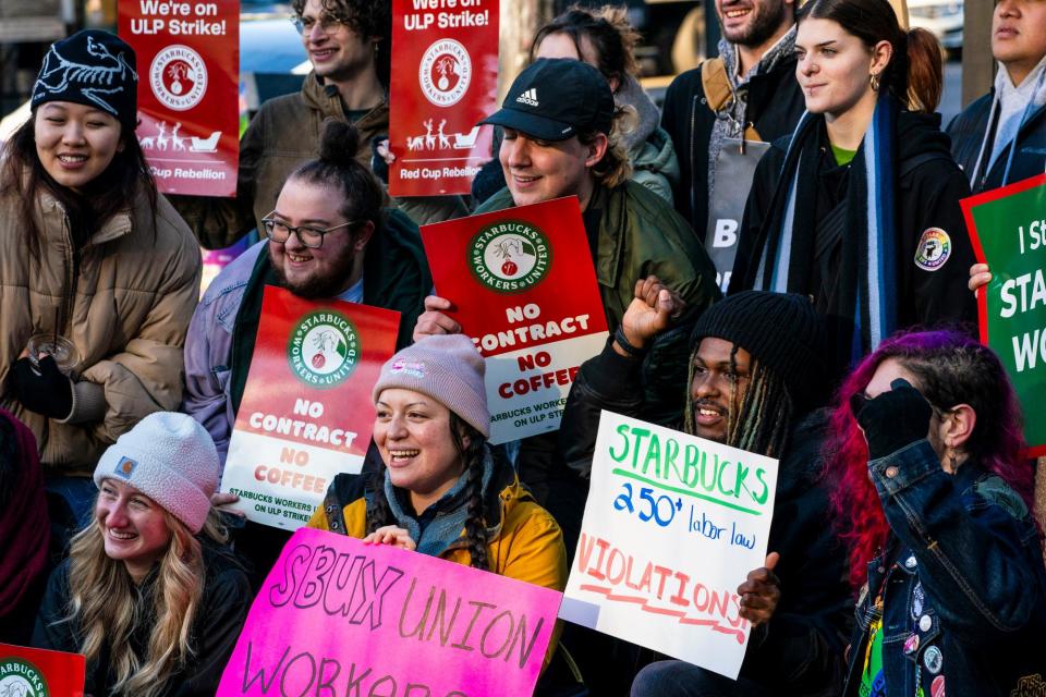 <span>Starbucks Workers United union members and supporters take a group photo outside a Starbucks location in Seattle, Washington last year.</span><span>Photograph: David Ryder/Bloomberg via Getty Images</span>