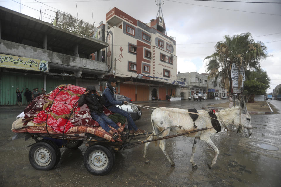 Palestinians flee from the eastern side of the southern Gaza city of Rafah after the Israeli army orders them to evacuate ahead of a military operation, in Rafah, Gaza Strip, Monday, May 6, 2024. The order affects tens of thousands of people and could signal a broader invasion of Rafah, which Israel has identified as Hamas' last major stronghold after seven months of war. (AP Photo/Ismael Abu Dayyah)