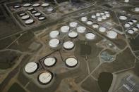 Crude oil storage tanks are seen from above at the Cushing oil hub, in Cushing, Oklahoma, March 24, 2016. REUTERS/Nick Oxford