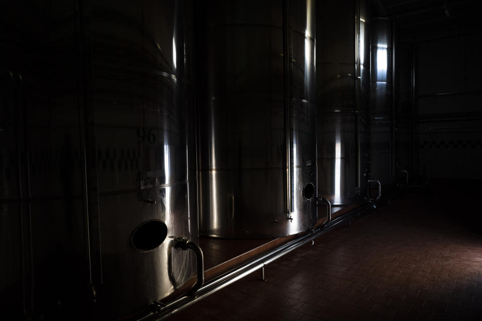 Tanks are used to store olive oil at the "La Betica Aceitera" oil mill in the southern town of Quesada, a rural community in the heartland of Spain's olive country, Thursday, Oct. 27, 2022. (AP Photo/Bernat Armangue)