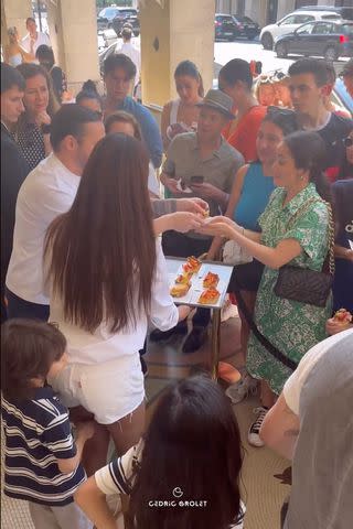 <p>Instagram/cedricgrolet</p> Zoe Saldaña and her family hand out pastries to people outside Cedric Grolet's bakery