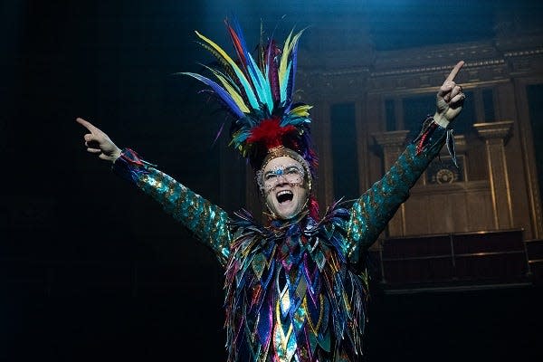 Taron Egerton crows as Elton John in "Rocketman."