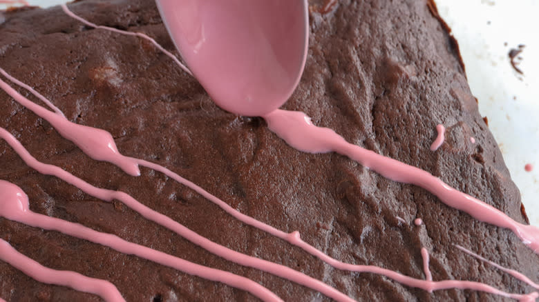 pink frosting stripes on brownies