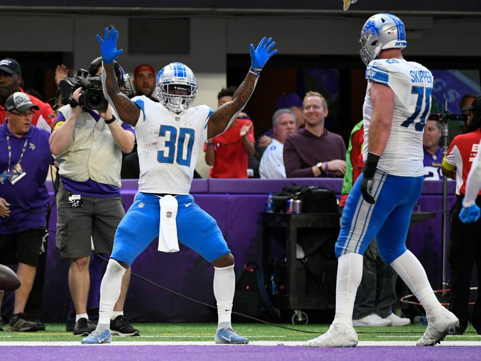 Jamaal Williams celebrates a touchdown against the Minnesota Vikings.