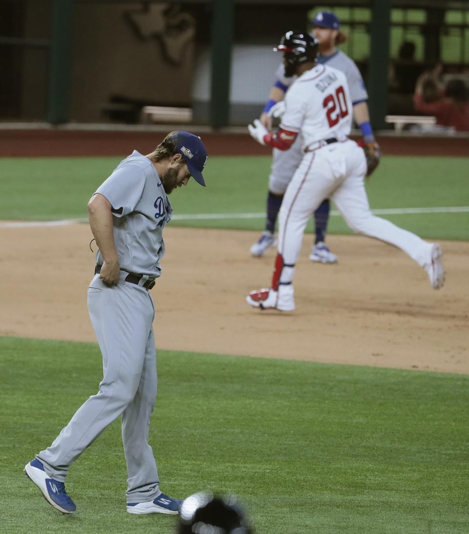 Atlanta Braves designated hitter Marcell Ozuna rounds the bases after hitting a home run off Clayton Kershaw.