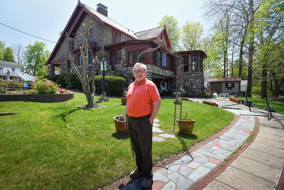 Bill Darr of Eaton Rapids is pictured Tuesday, May 9, 2023, in the backyard of his 1918 "storybook house" on South River Street in Eaton Rapids.