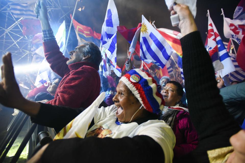 A supporter of presidential frontrunner Daniel Martinez, of the ruling party Broad Front, cheers during his closing campaign rally in Montevideo, Uruguay, Wednesday, Oct. 23, 2019. Martinez, a former mayor of Uruguay's capital, will face off against the son of a former president in upcoming Oct. 27 general election. (AP Photo/Matilde Campodonico)