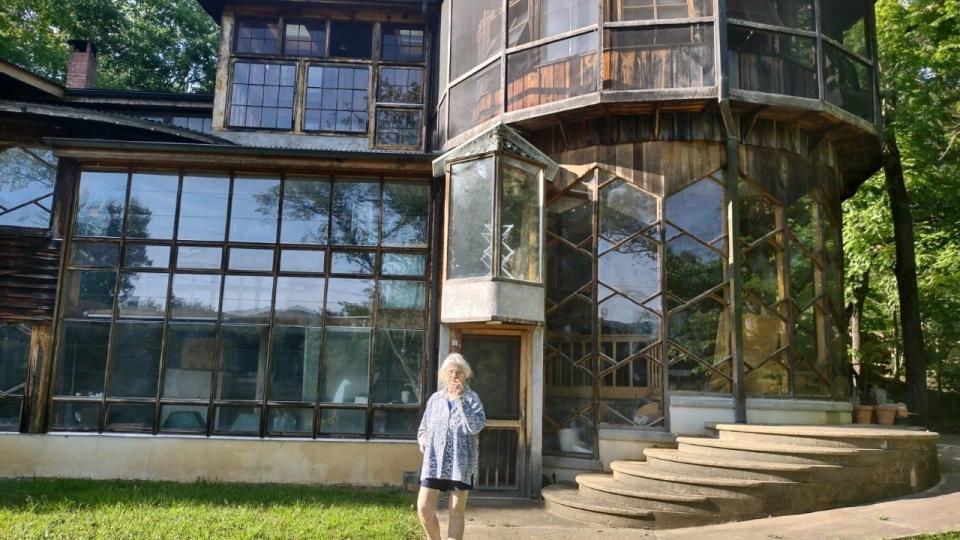 Camille Shafer stands before Azule, the artist residency she founded in 1972, which is located on a 35-acre property in the Trust community of Hot Springs.