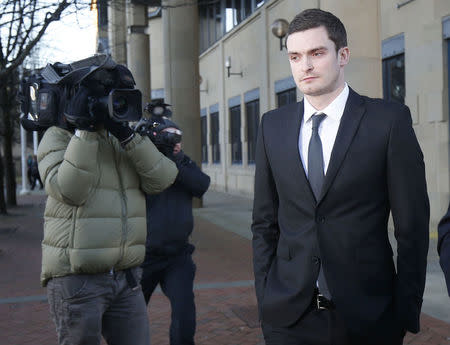 Sunderland soccer player Adam Johnson (R) leaves Bradford Crown Court in Bradford, Britain February 10, 2016. REUTERS/Andrew Yates