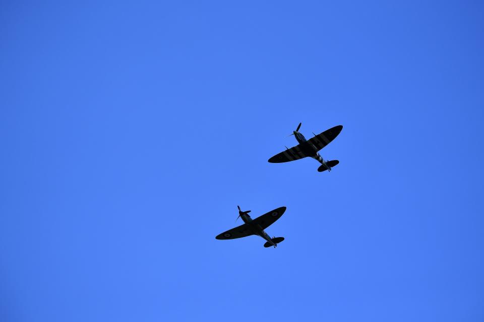 Spitfire planes perform a fly-past above Ditchling, south of London, on July 10, 2020, during the funeral of WWII performer Vera Lynn. - People gathered on the streets of to bid a final farewell Friday, to World War II "forces' sweetheart"  Vera Lynn, who died last month. A performer from the age of seven, Lynn also starred in films, enjoyed a number of post-war hits and was made a Dame of the British Empire in 1976. (Photo by Ben STANSALL / AFP) (Photo by BEN STANSALL/AFP via Getty Images)