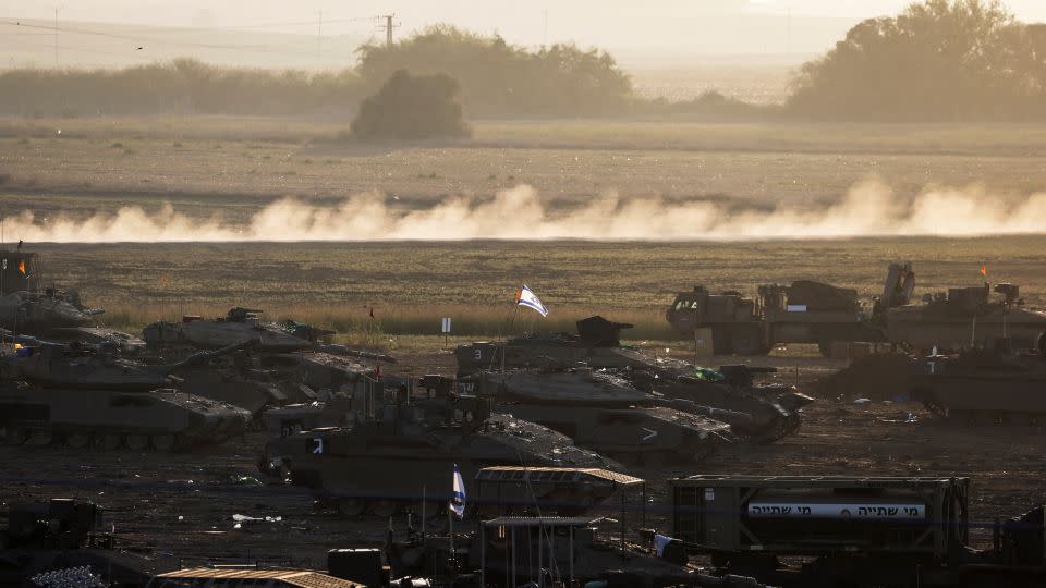 A formation of Israeli tanks and other military is positioned near Israel's border with the Gaza Strip, in southern Israel October 20, 2023. - Violeta Santos Moura/Reuters